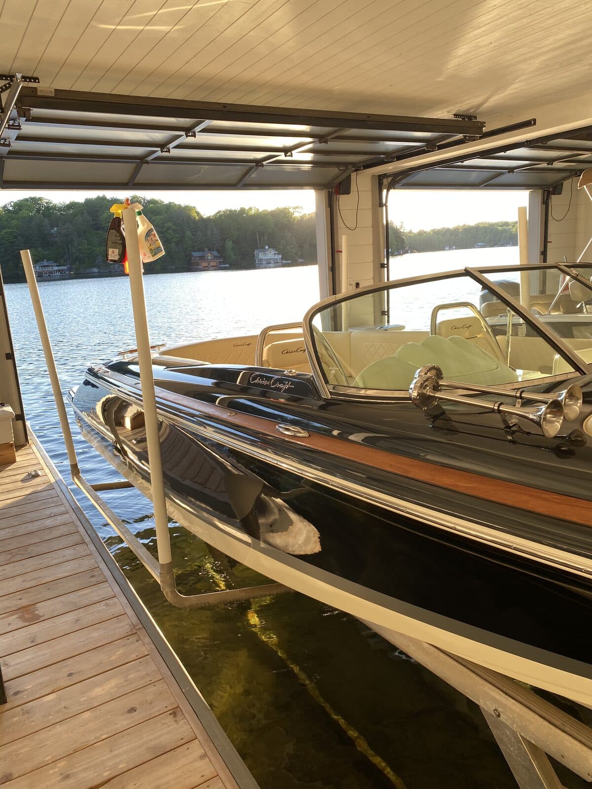 Classic boat in a Muskoka boathouse at sunset
